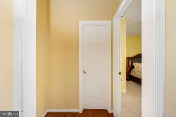 a spacious bedroom with a bed a couch and a window