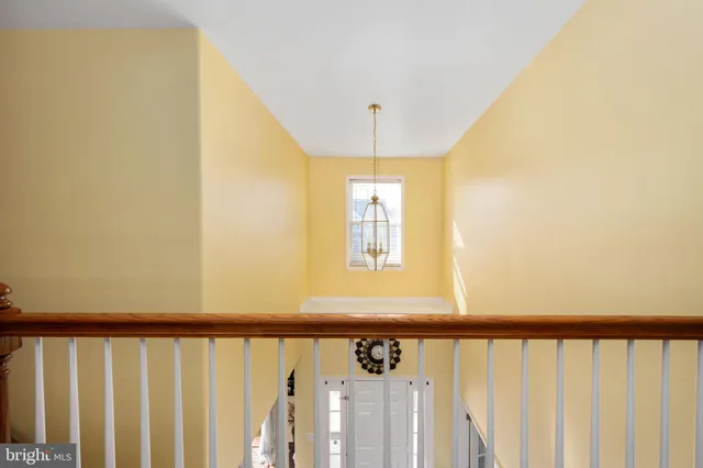 a bedroom with a bed and a chair