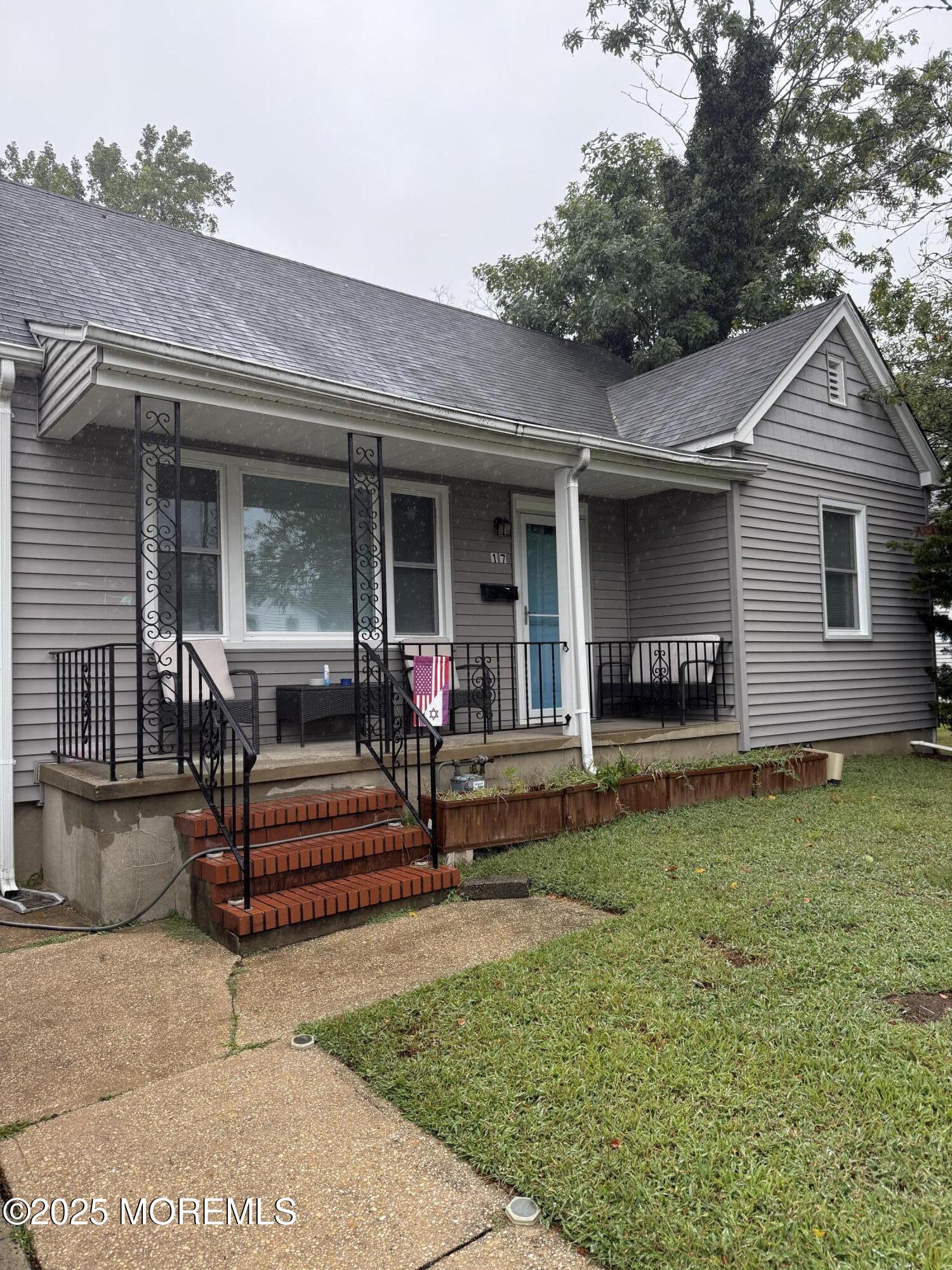 a backyard of a house with seating space