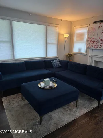 a living room with furniture and a rug