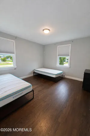 a bed room with a bed and a window