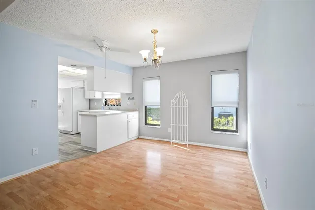 a view of a kitchen with a sink cabinets and a window