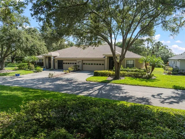 a view of a house with swimming pool and porch