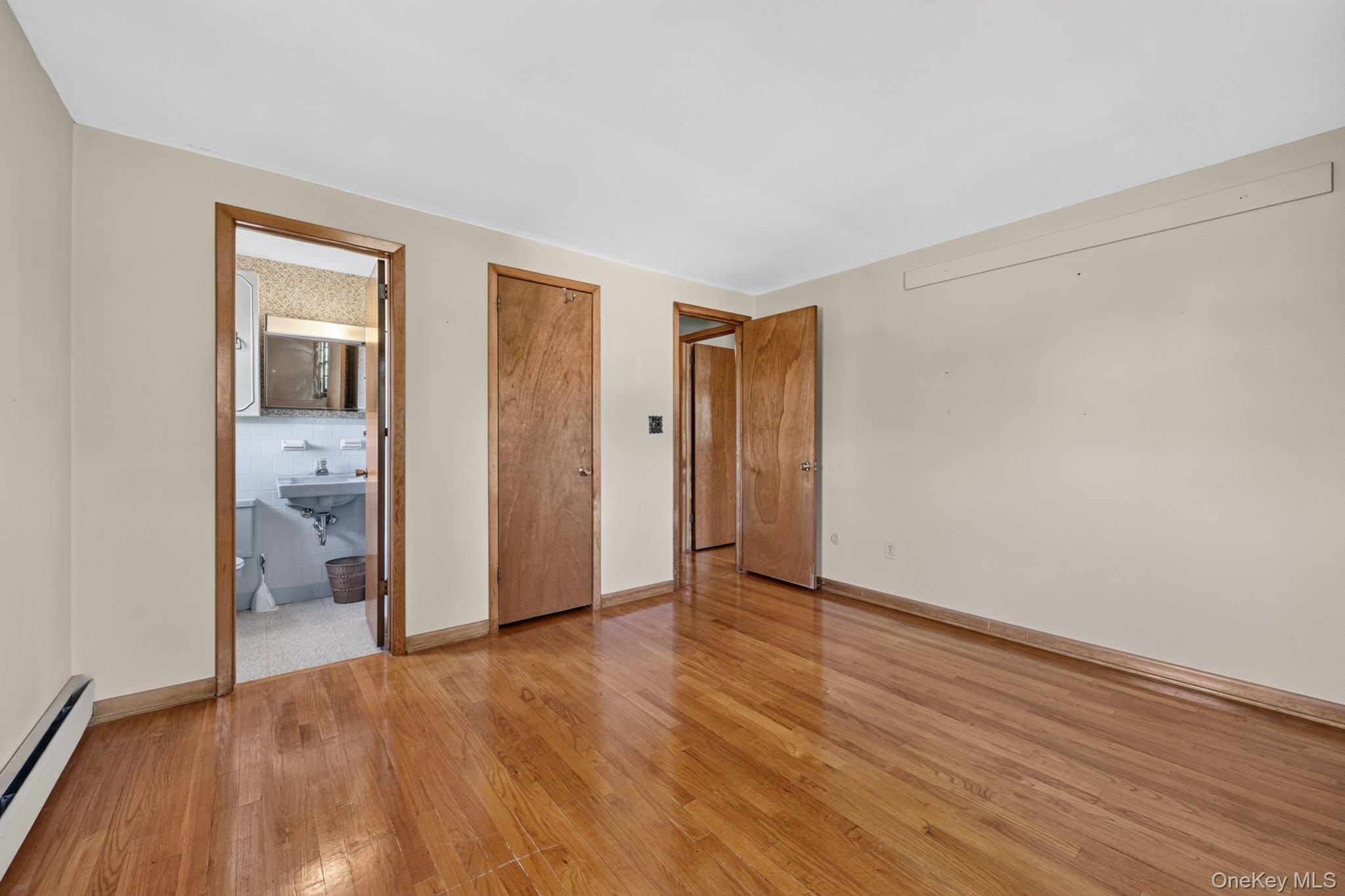 315 Pine Bush Road Stone Ridge, NY 12484 - Photo 18 of 32 a view of an empty room with wooden floor and closet