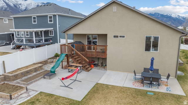 1896 West 800 North Mapleton, UT 84663 - Photo 40 of 55 Back of house featuring a patio area, stucco siding, and a deck with mountain view
