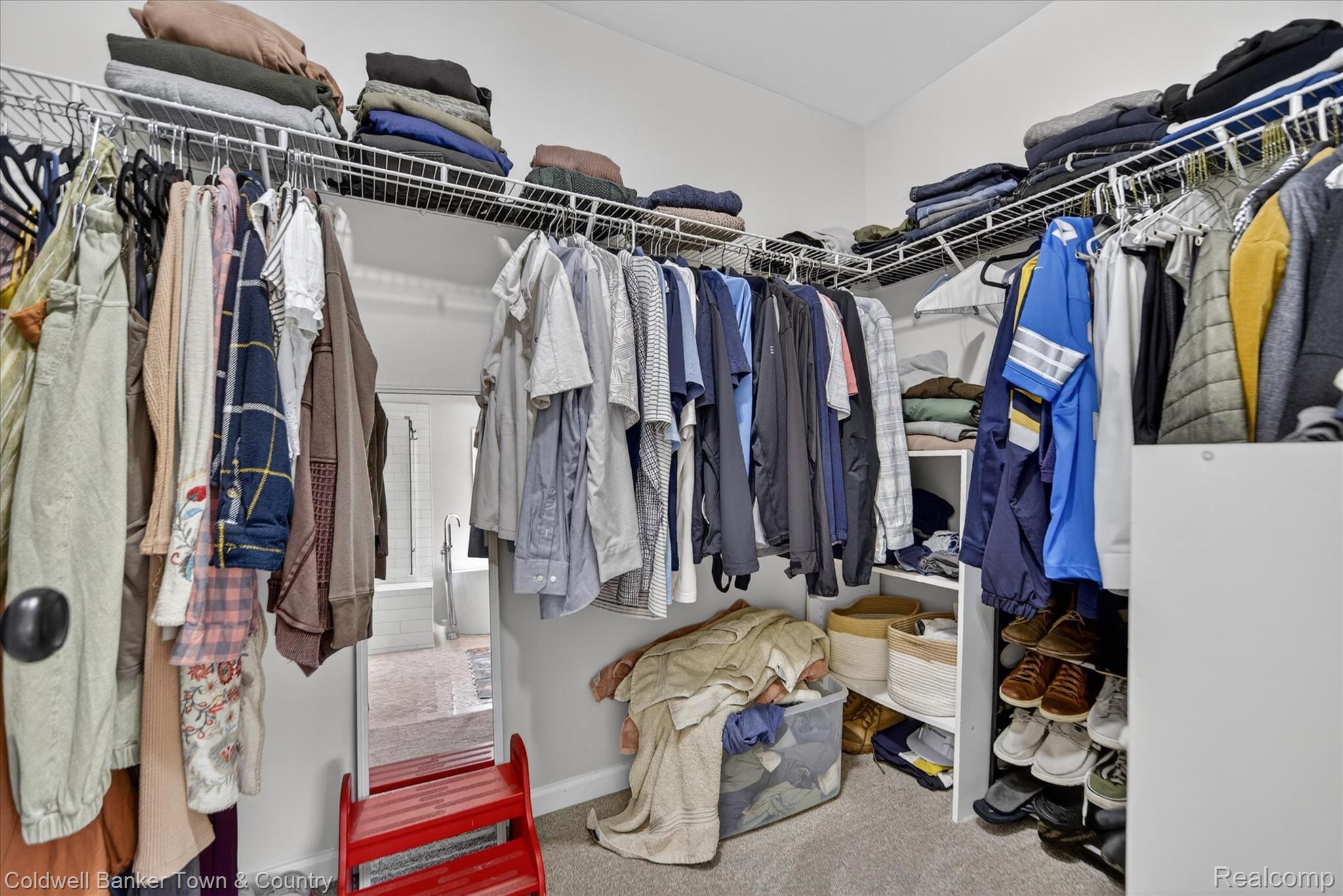 918 Gray Fox Court Howell, MI 48843 - Photo 36 of 84 Walk-in closet featuring white wire shelving, hanging rods, and built-in vertical storage compartments