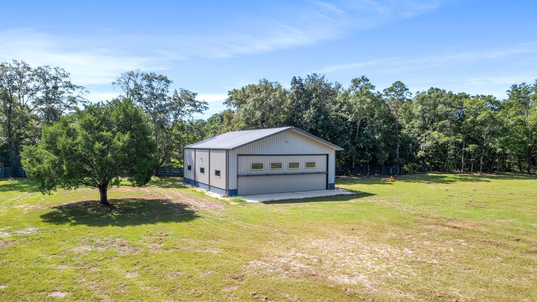 147 Dexton King Freeport, FL 32439 - Photo 17 of 23 a view of a house with a yard