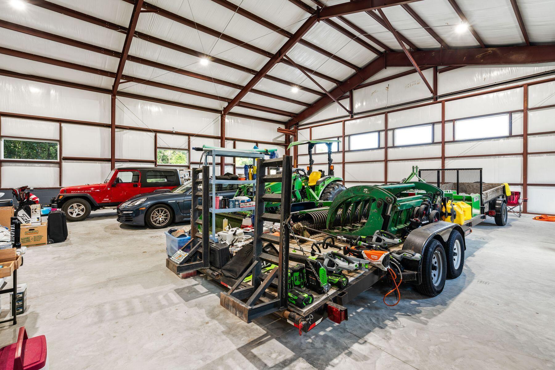 147 Dexton King Freeport, FL 32439 - Photo 18 of 23 a view of a garage with a bike and a car parked