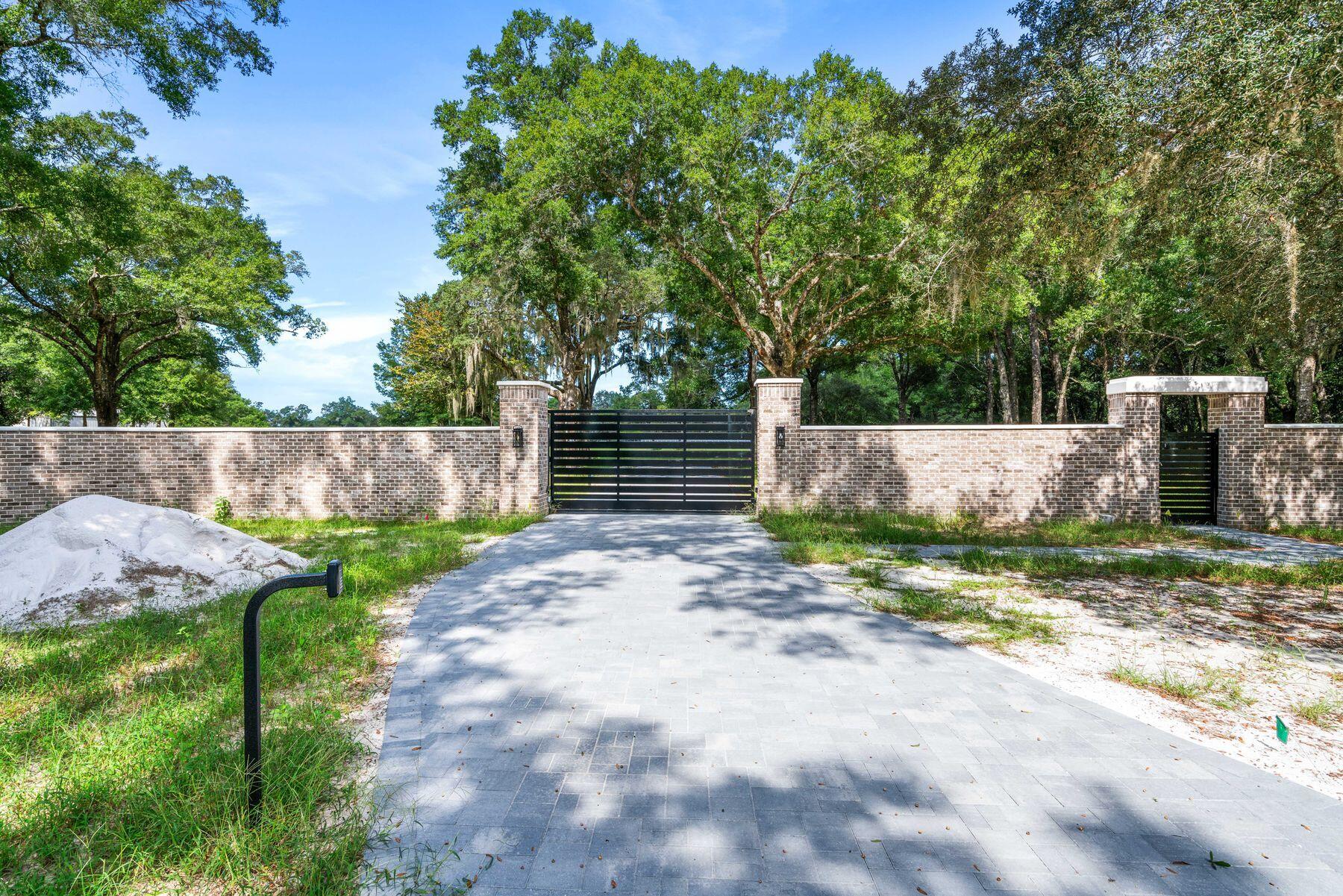 147 Dexton King Freeport, FL 32439 - Photo 22 of 23 a view of backyard and tree