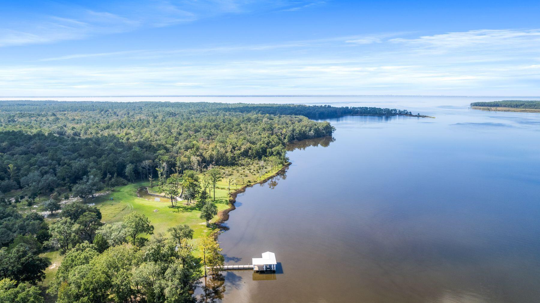 147 Dexton King Freeport, FL 32439 - Photo 5 of 23 a view of a lake with a city