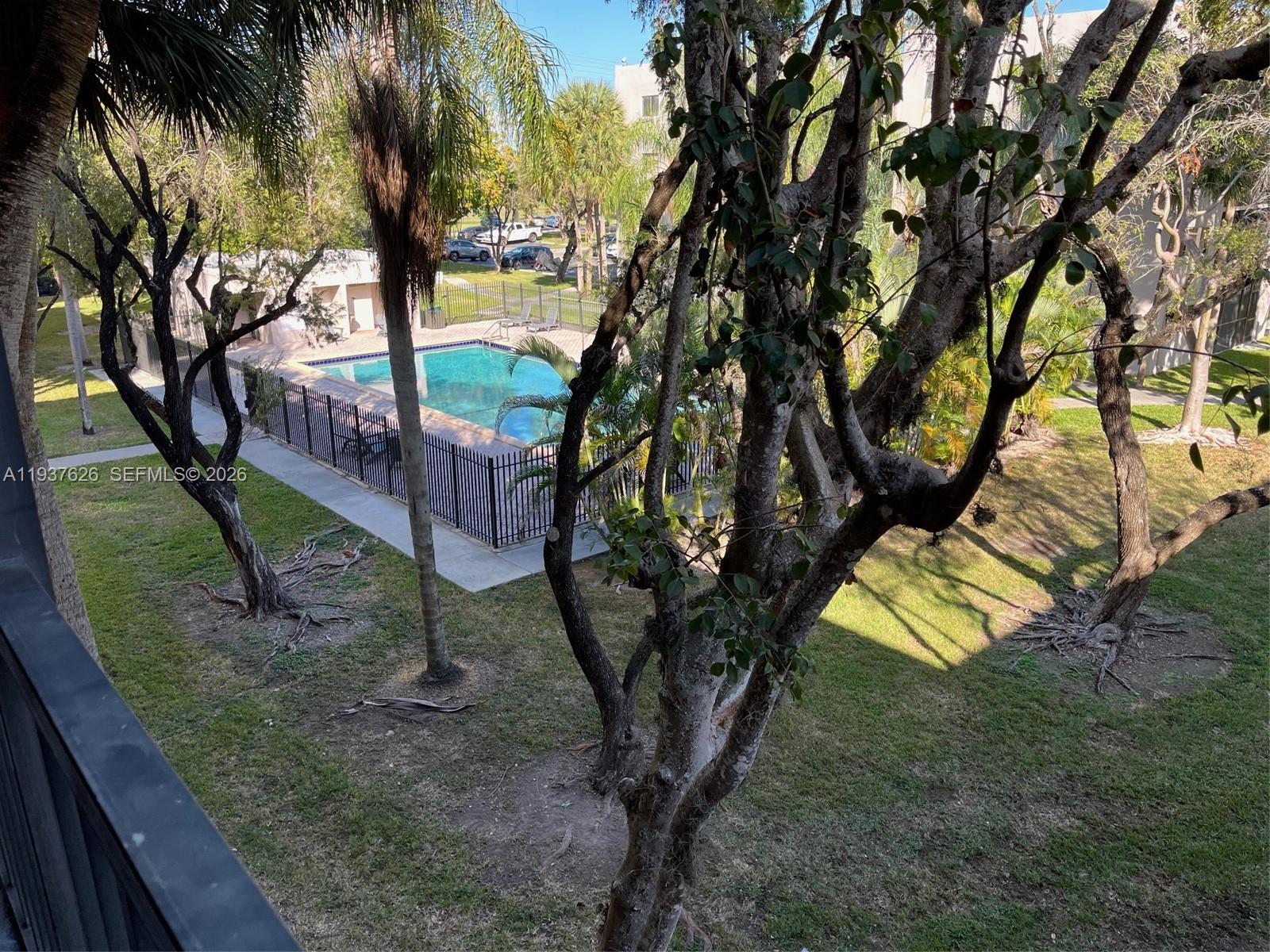 8420 Southwest 133rd Avenue Road, Unit 308 Miami, FL 33183 - Photo 1 of 16 a view of a yard with a tree