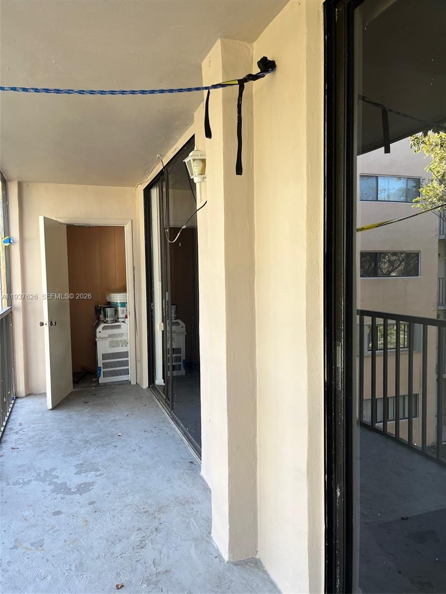 8420 Southwest 133rd Avenue Road, Unit 308 Miami, FL 33183 - Photo 3 of 16 a view of a hallway to a bedroom