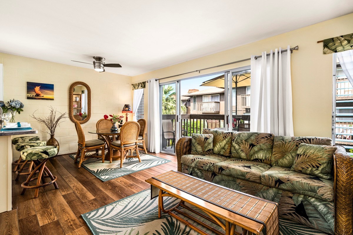 Great Room of totally remodeled & fully furnished Malia Kai #15 Townhouse with luxury vinyl tile flooring, newly painted walls throughout & all cottage cheese ceilings removed.