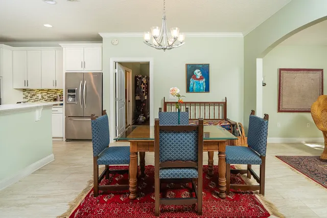 a open kitchen with stainless steel appliances granite countertop a stove refrigerator and cabinets