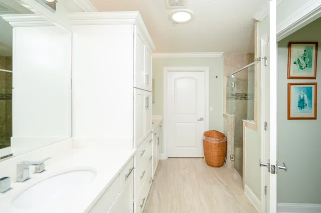 a front view of a house with a yard and fountain