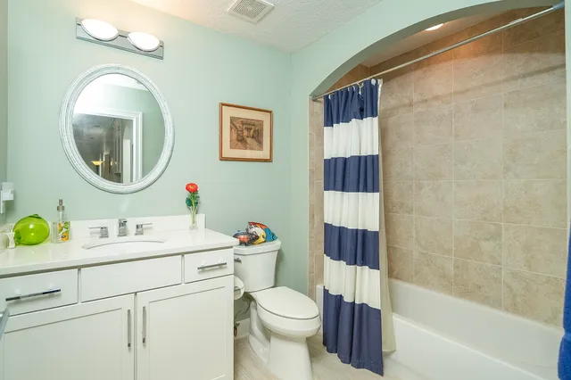 a view of a house with swimming pool and sitting area