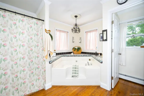 a bathroom with a sink a mirror and a shower