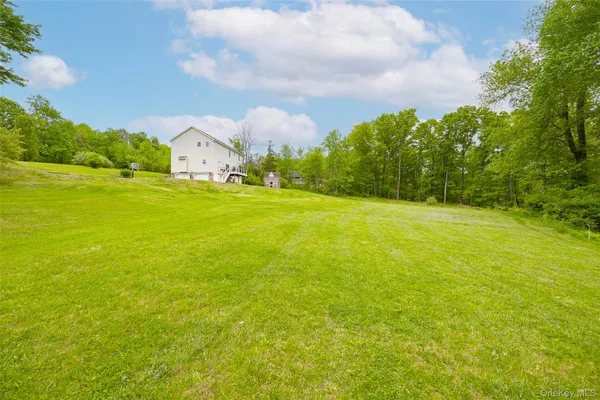 a backyard of a house with lots of green space
