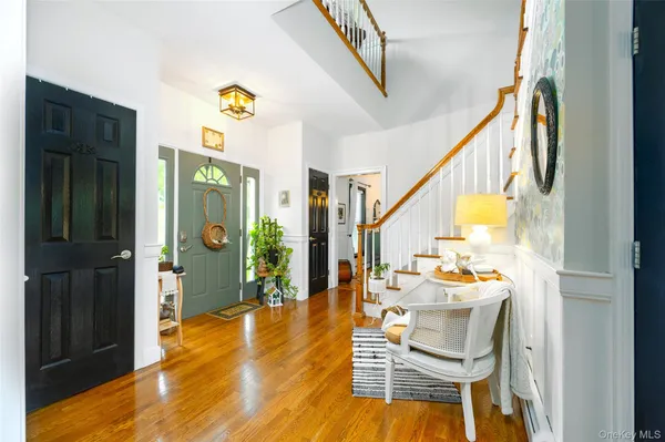 a view of dining room with furniture and wooden floor