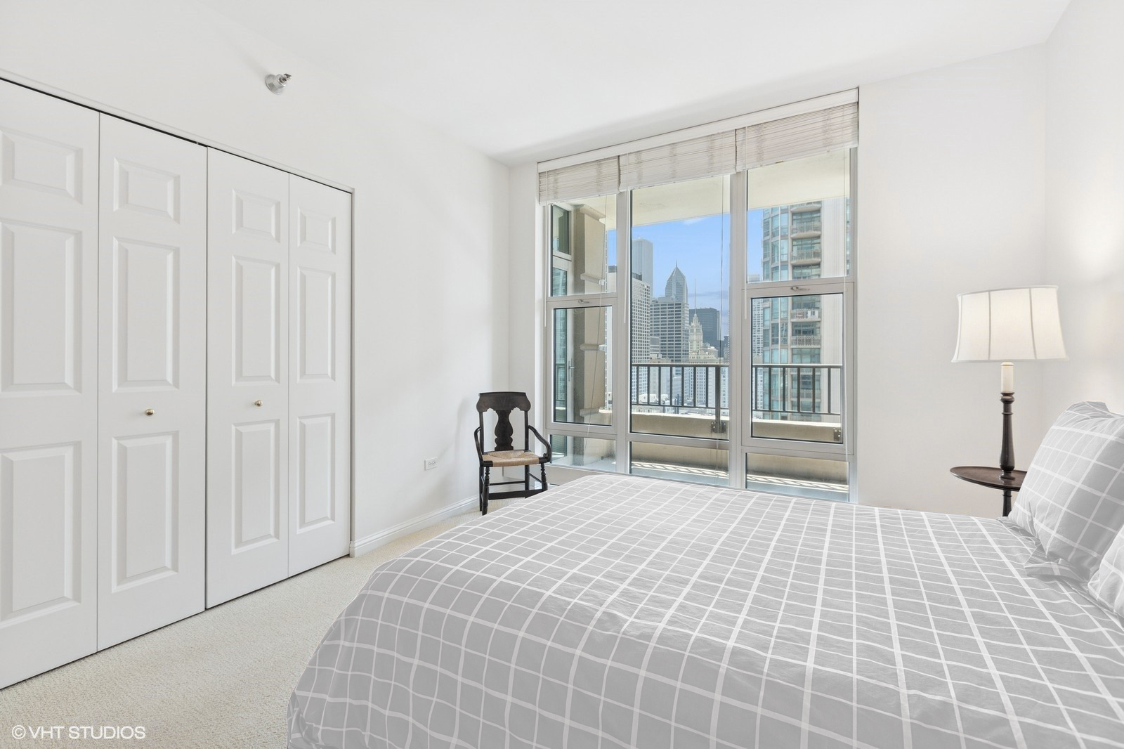 25 East Superior Street, Unit 2405 Chicago, IL 60611 - Photo 15 of 26 a bedroom with a bed and a window
