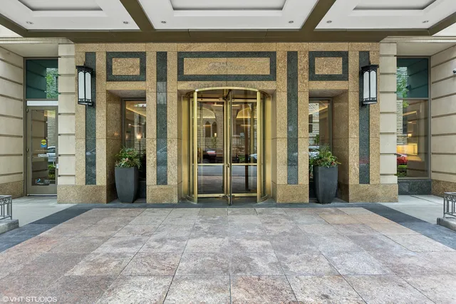 a view of a building with a potted plant in front of building