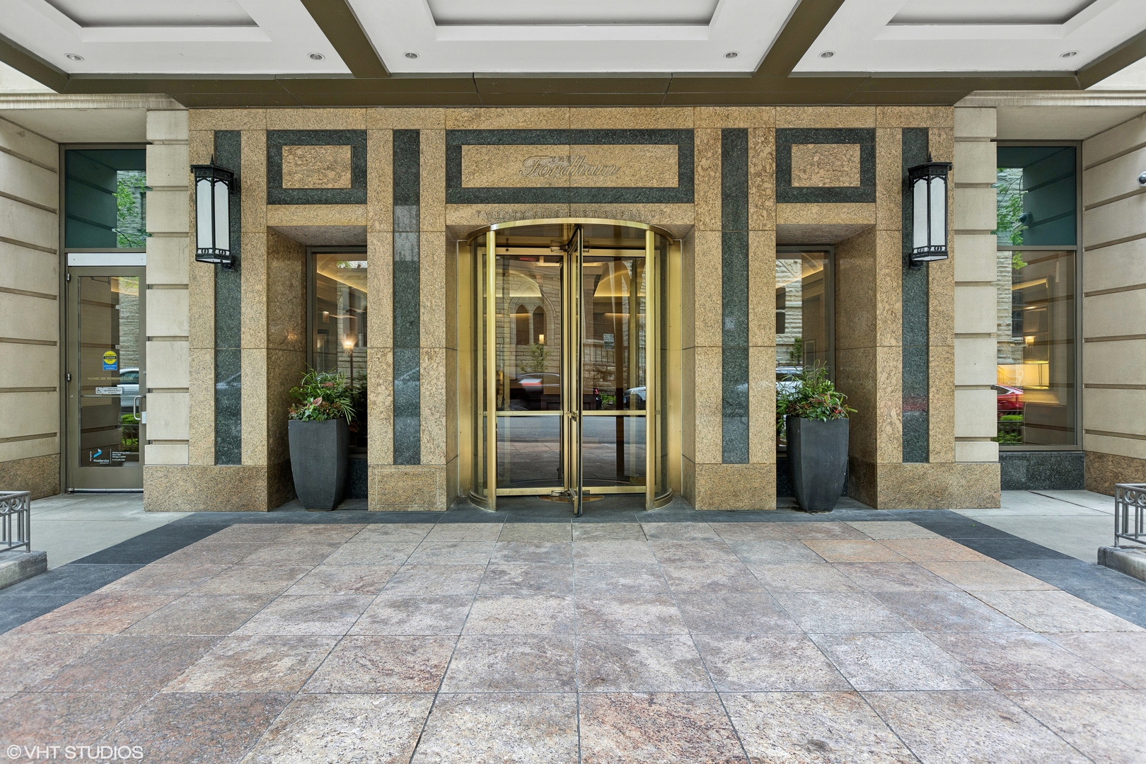 25 East Superior Street, Unit 2405 Chicago, IL 60611 - Photo 2 of 26 a view of a building with a potted plant in front of building