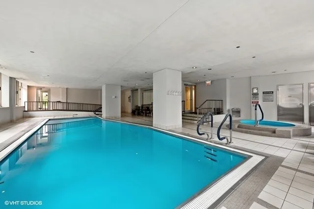 a swimming pool with outdoor seating