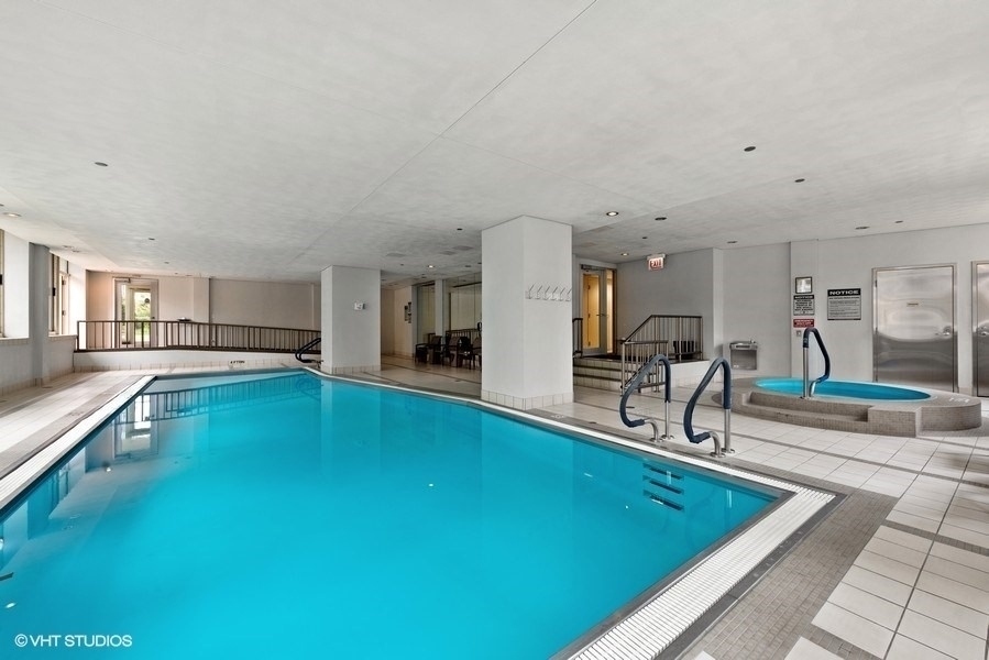 25 East Superior Street, Unit 2405 Chicago, IL 60611 - Photo 22 of 26 a swimming pool with outdoor seating