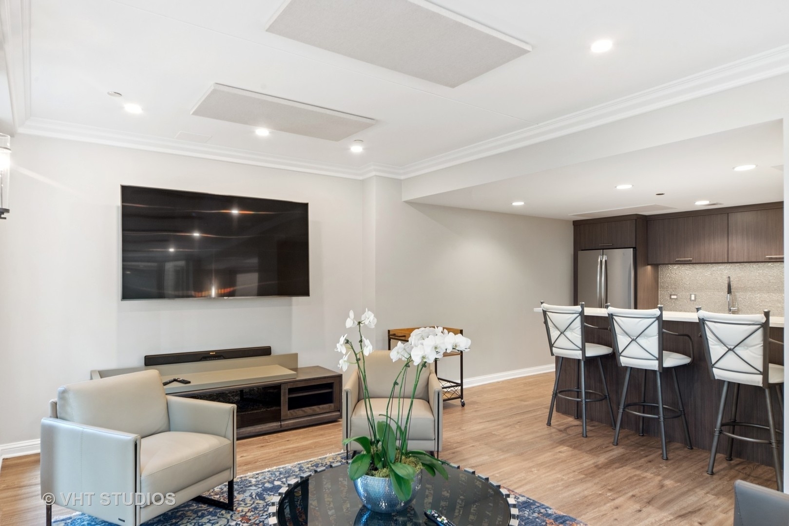 25 East Superior Street, Unit 2405 Chicago, IL 60611 - Photo 26 of 26 a living room with furniture and a flat screen tv