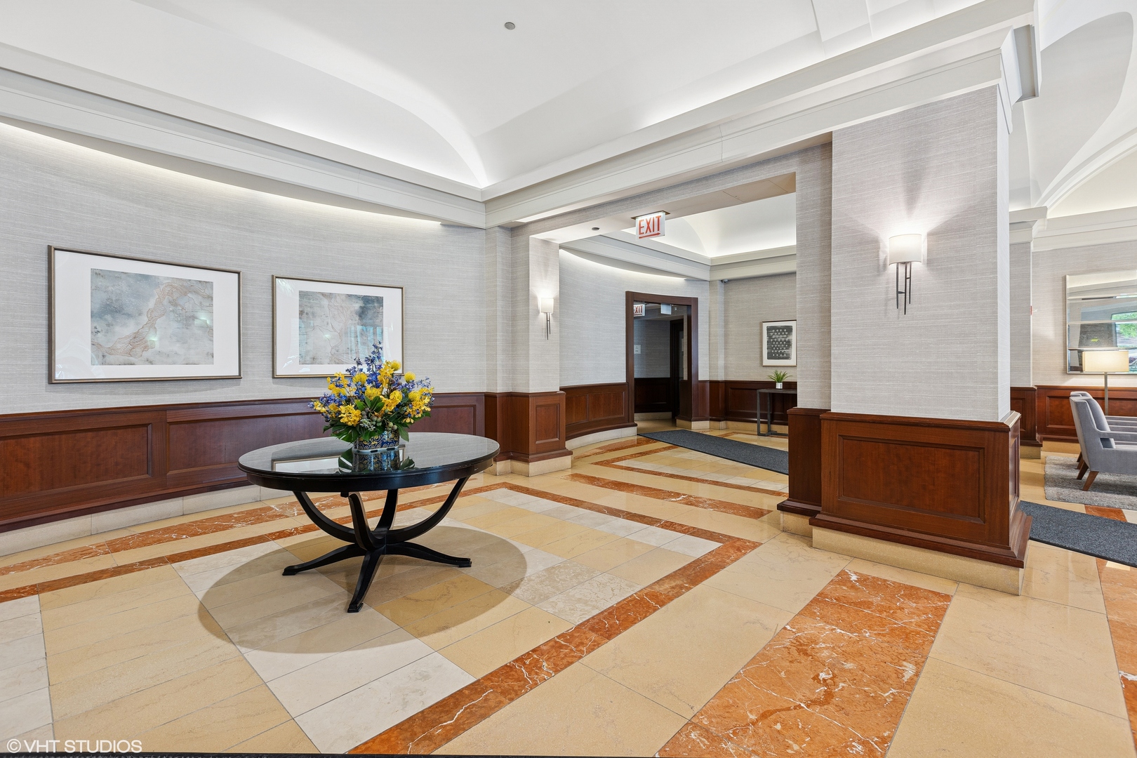 25 East Superior Street, Unit 2405 Chicago, IL 60611 - Photo 4 of 26 a living room filled with furniture and a painting on the wall
