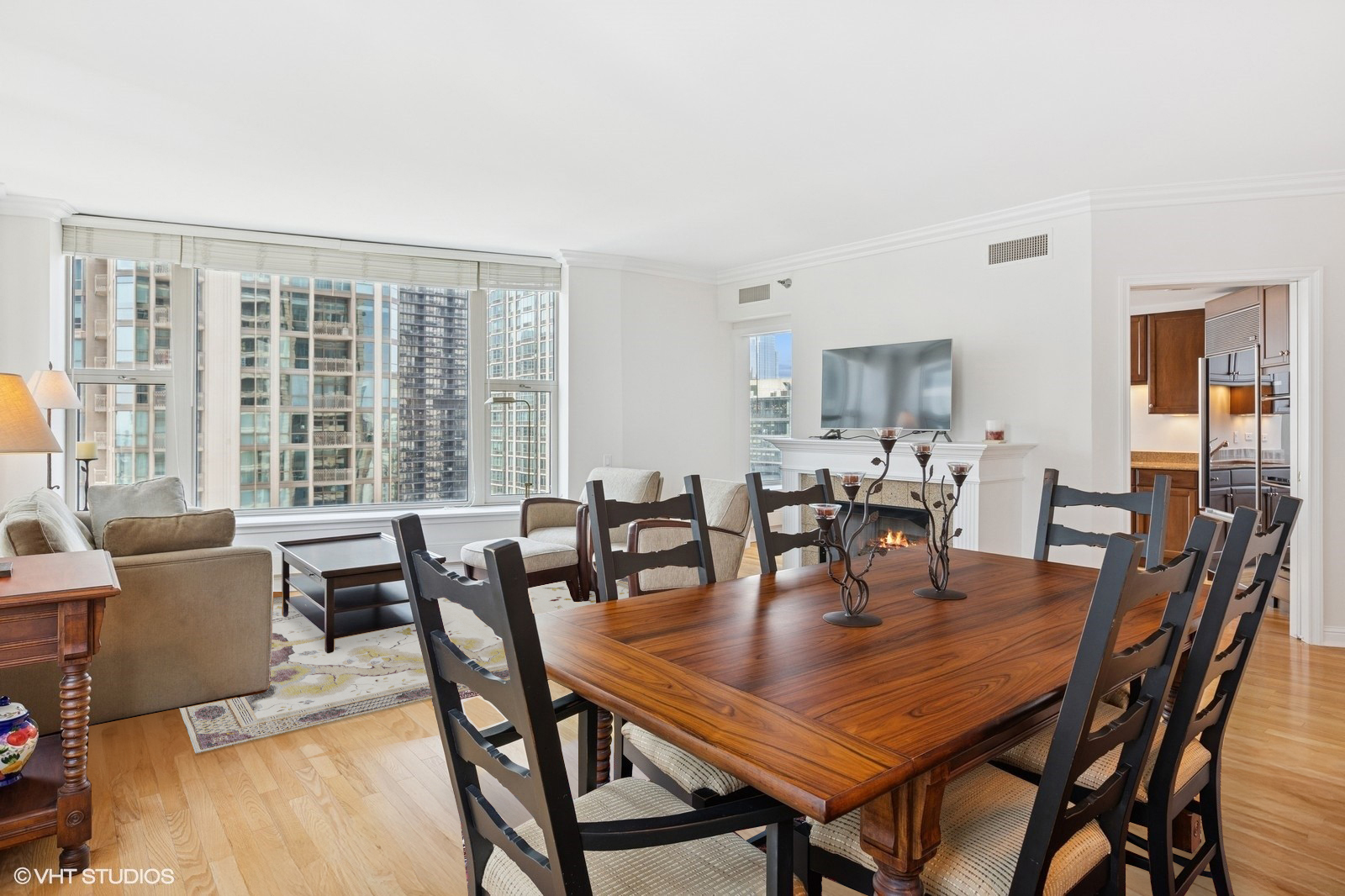 25 East Superior Street, Unit 2405 Chicago, IL 60611 - Photo 7 of 26 a view of a dining room with furniture and window