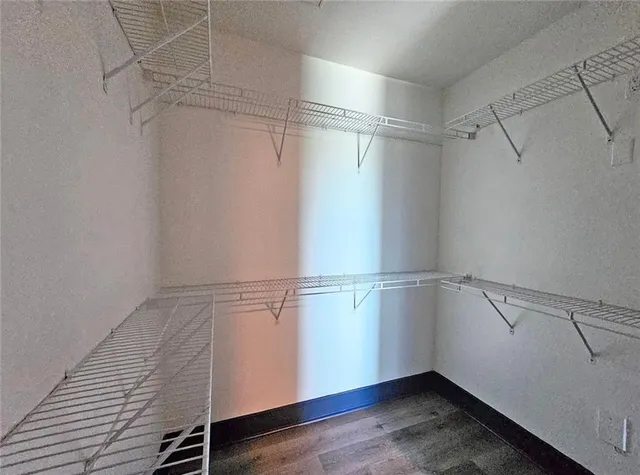 a view of an empty walk in closet