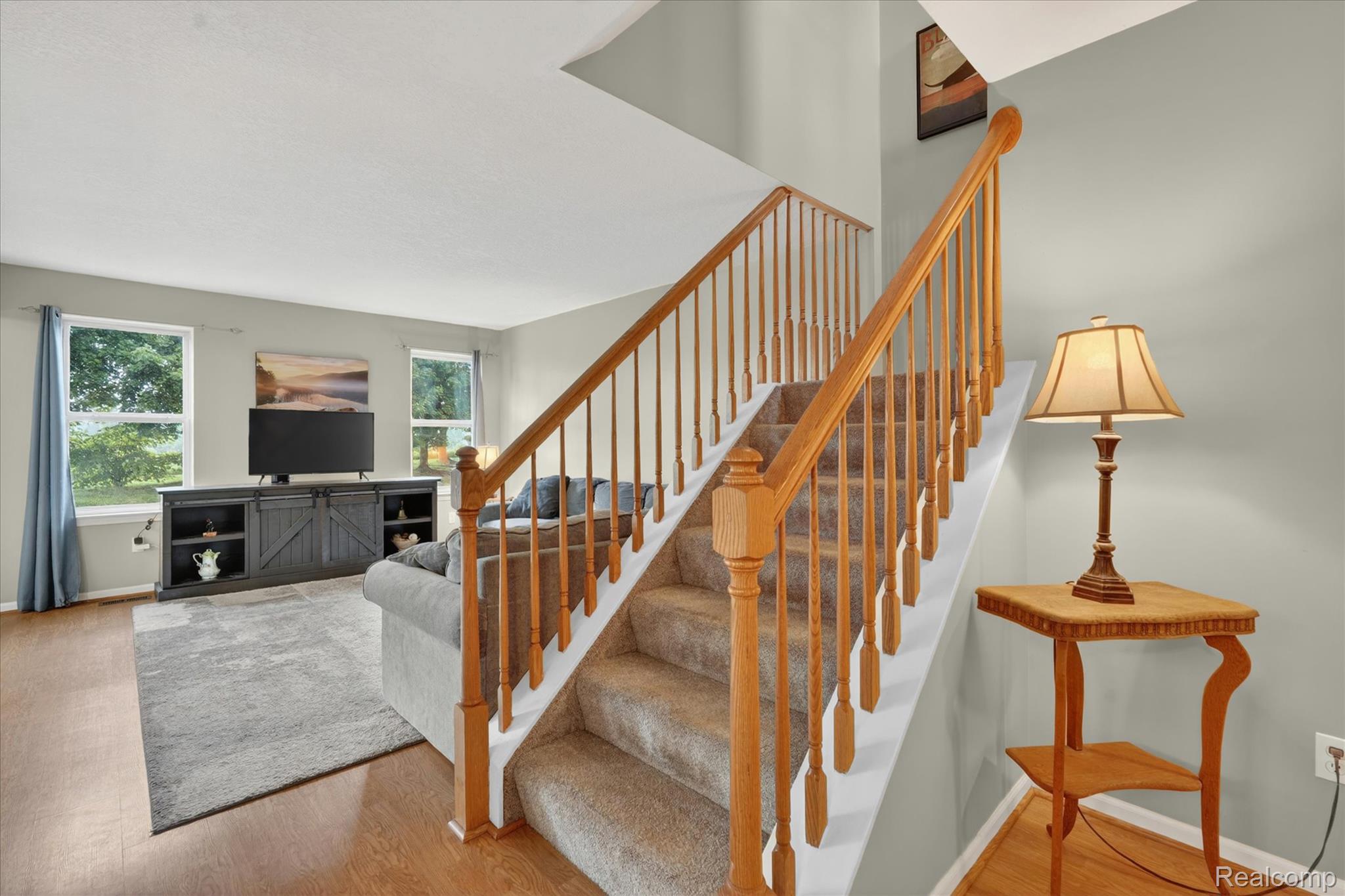 456 Lilly View Court Howell, MI 48843 - Photo 15 of 45 Carpeted staircase with wood banister and balusters
