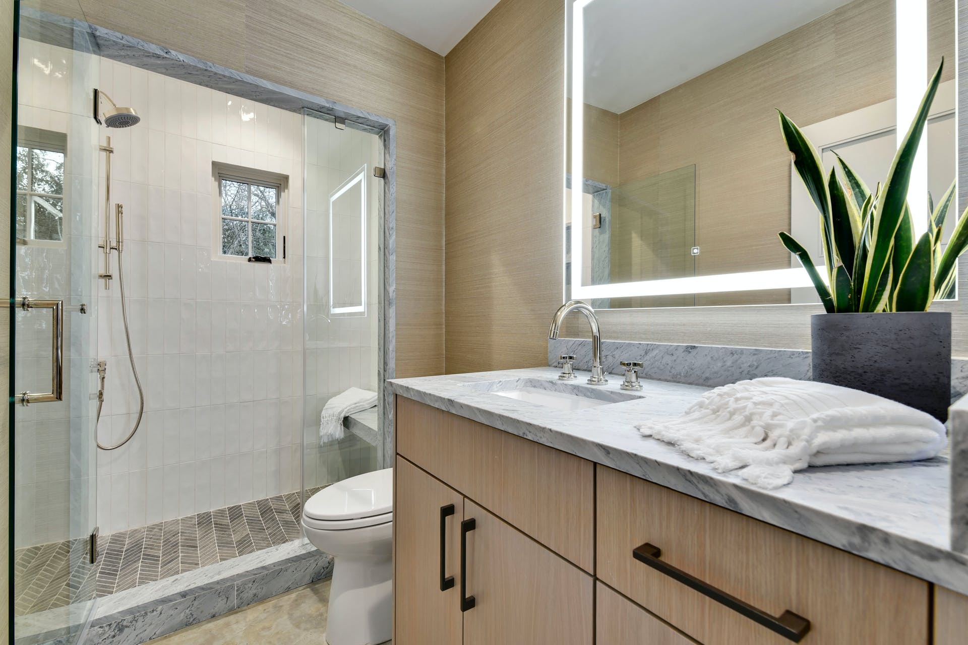 2607 River Hills Road, Unit G Austin, TX 78733 - Photo 12 of 31 a bathroom with a granite countertop sink a toilet and shower