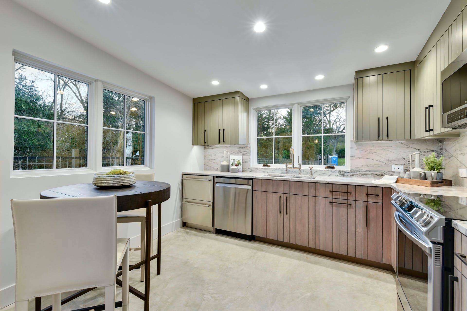 2607 River Hills Road, Unit G Austin, TX 78733 - Photo 13 of 31 a kitchen with granite countertop sink stove and chairs