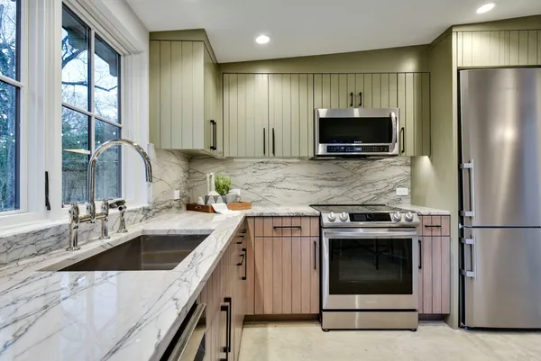 a kitchen with a sink stove and refrigerator