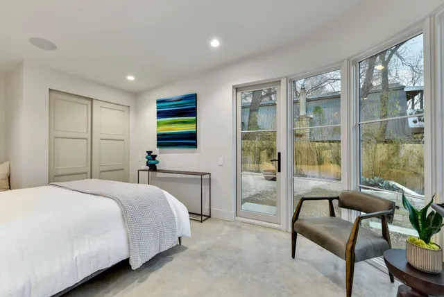 a bedroom with a bed and a couch