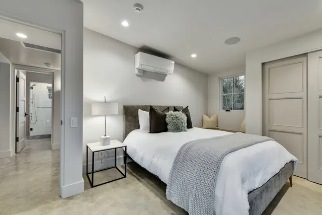 a bedroom with a bed and a walk in closet