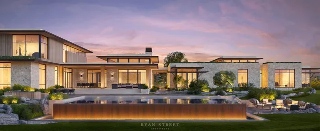 a view of a house with swimming pool and chairs