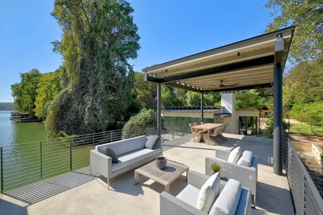 a view of a patio with couches chairs and a table and chairs