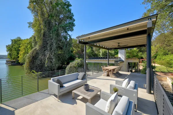 a view of a patio with couches chairs and a table and chairs