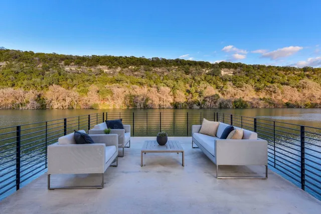 a terrace view with seating space and water view