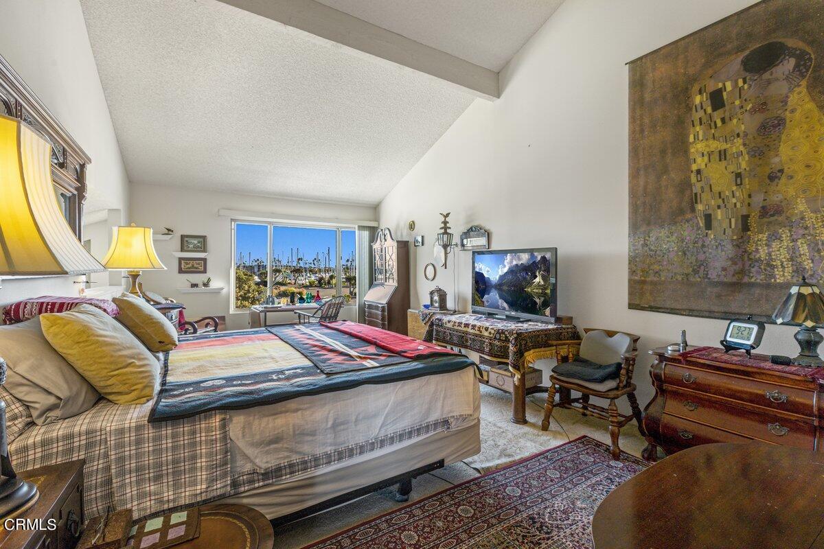 3330 Sunset Lane Oxnard, CA 93035 - Photo 16 of 29 a bedroom with a bed and wooden floor