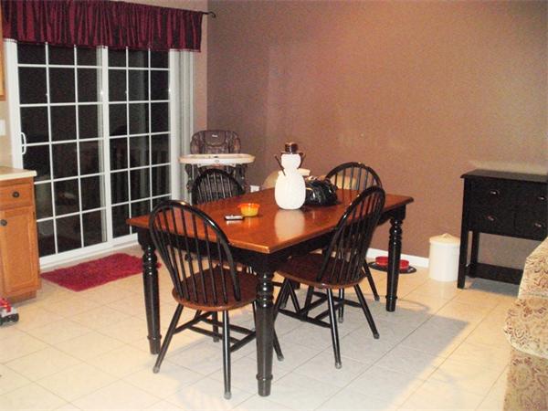 73 Musquash Road Hudson, NH 03051 - Photo 1 of 14 a view of a dining room with furniture and wooden floor