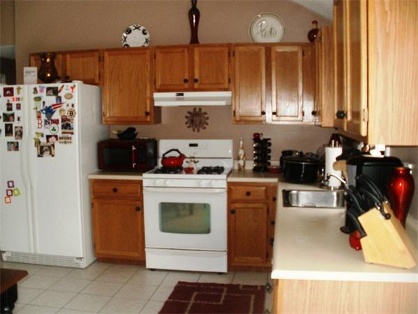 73 Musquash Road Hudson, NH 03051 - Photo 4 of 14 a kitchen with stainless steel appliances granite countertop a refrigerator a stove and a cabinets
