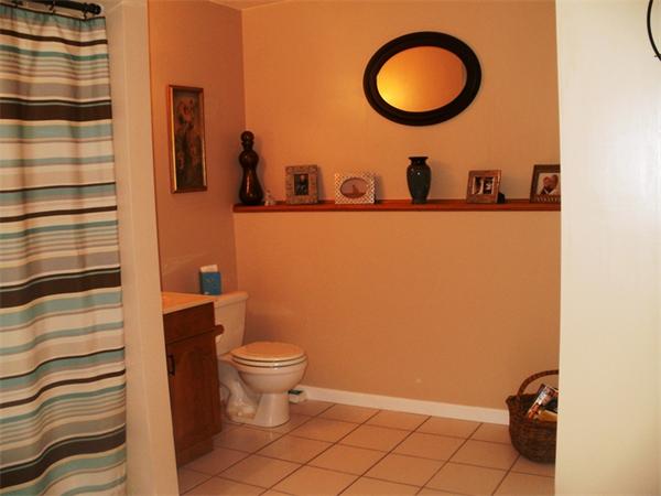 73 Musquash Road Hudson, NH 03051 - Photo 7 of 14 a bathroom with a toilet and a sink