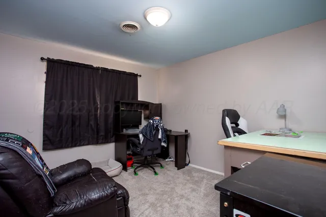 a view of a workspace with furniture