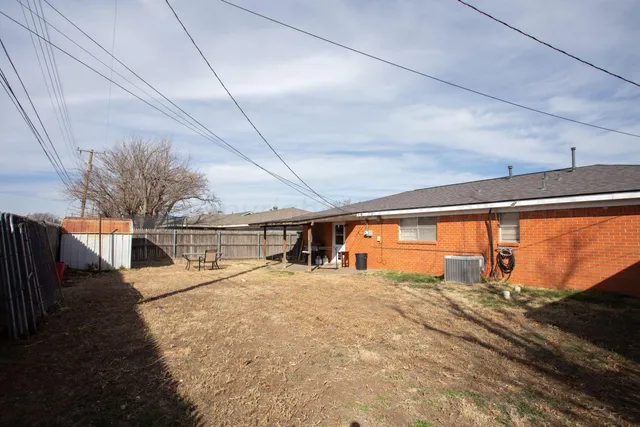 a view of an empty room with a floor to ceiling window