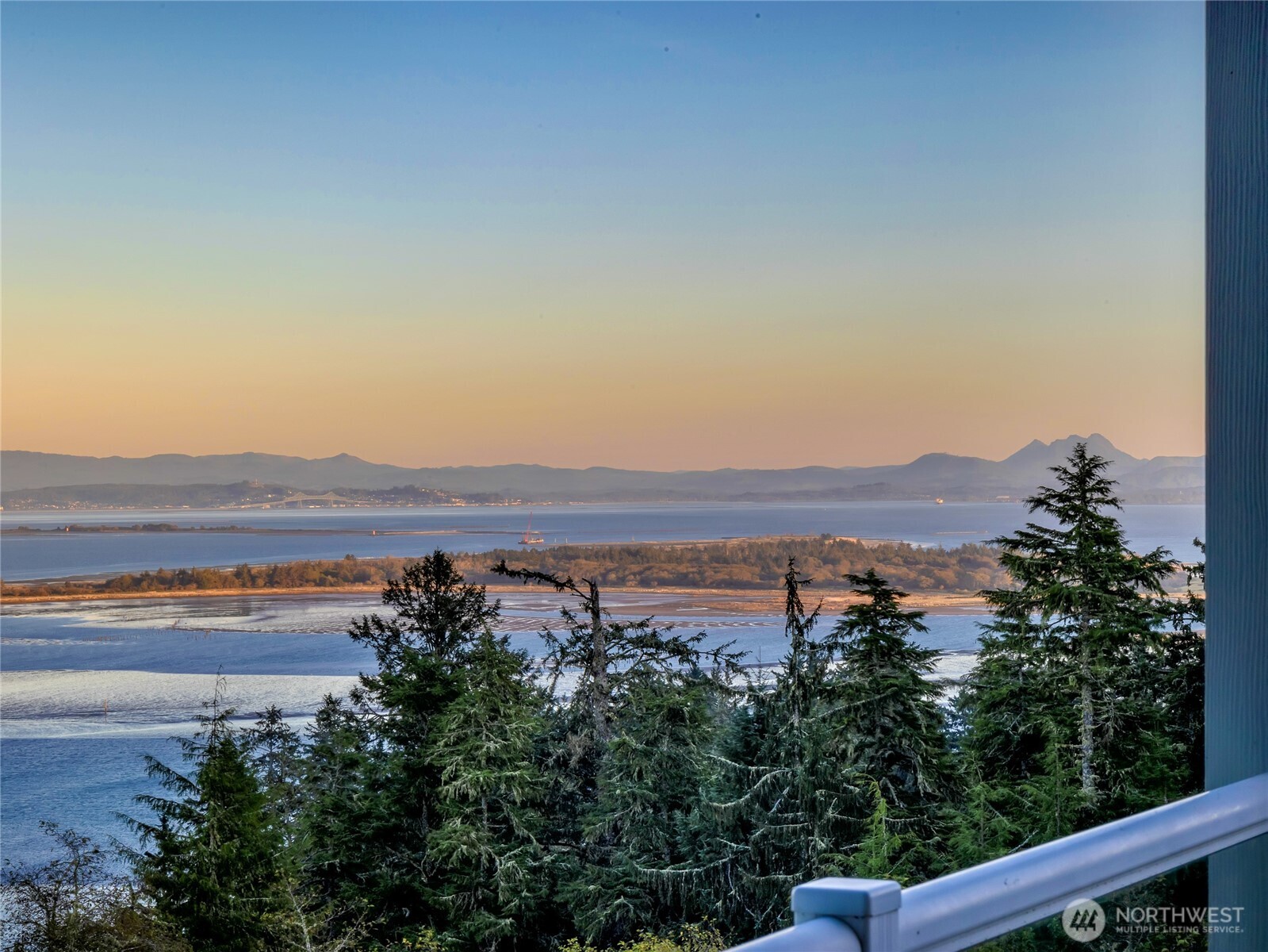 3224 Overlook Loop Ilwaco, WA 98624 - Photo 17 of 40 a view of lake with mountain in the back