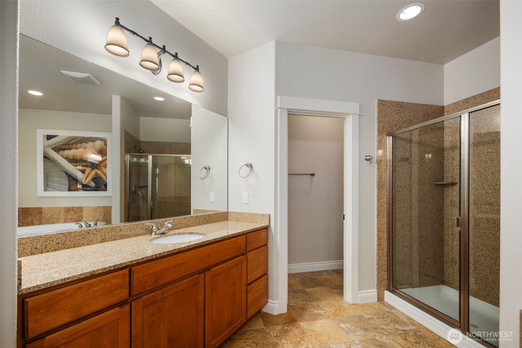 3224 Overlook Loop Ilwaco, WA 98624 - Photo 22 of 40 a bathroom with a granite countertop sink mirror and shower